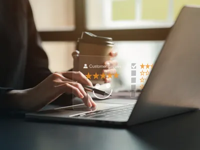 Modern workspace with laptop displaying SaaS platform dashboard